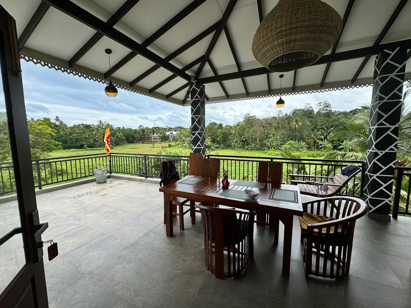 Open balcony overlooking the green surroundings of Monkey Island Villa